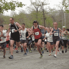 Norm Bouthillier and Katie Moulton, first place finishers, get a quick start at the the Rocky Point 5K on May 10, 2014.