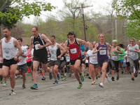 Norm Bouthillier and Katie Moulton, first place finishers, get a quick start at the the Rocky Point 5K on May 10, 2014.