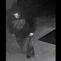 Surveillance footage of a suspect in an armed robbery, posted on the Rhode Island's Most Wanted website by the Warwick Police. CREDIT: Rhode Island's Most Wanted.
