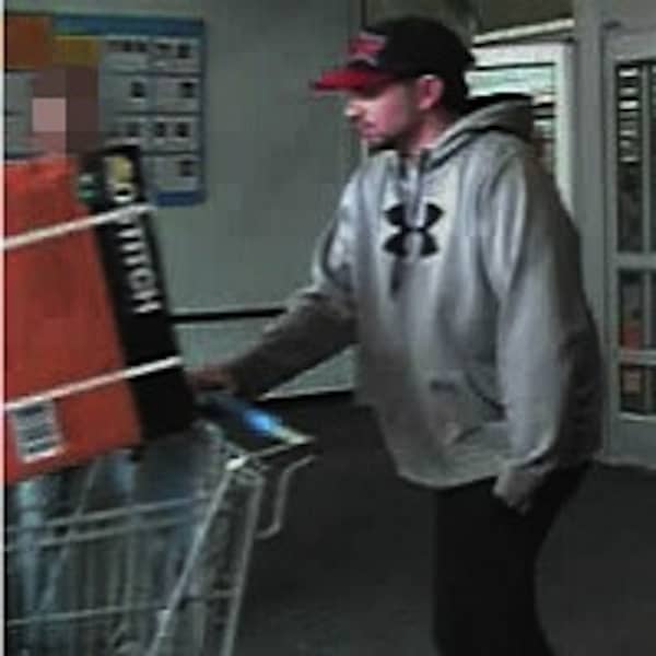 Warwick Police say this man switched the price tag to an air compressor, allowing him to leave the Post Road Walmart after paying just $15. CREDIT: Rhode Island Most Wanted