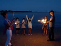 City Issues Call for Photo Submissions for Annual Calendar Scott and Cheryl Marble light up some sparklers with Faith Kennedy, 10, Teagan Marble, 10, Aiden Duffy, 10, and Daniel Kennedy, 8,.
