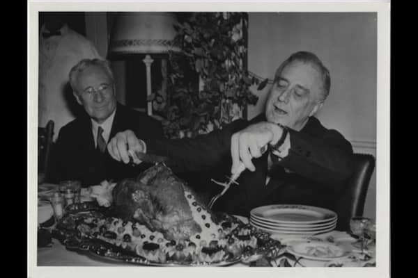 President Franklin D. Roosevelt carves the White House turkey on Nov. 20, 1933. FDR later signed the law setting Thanksgiving to the fourth Thursday in November.