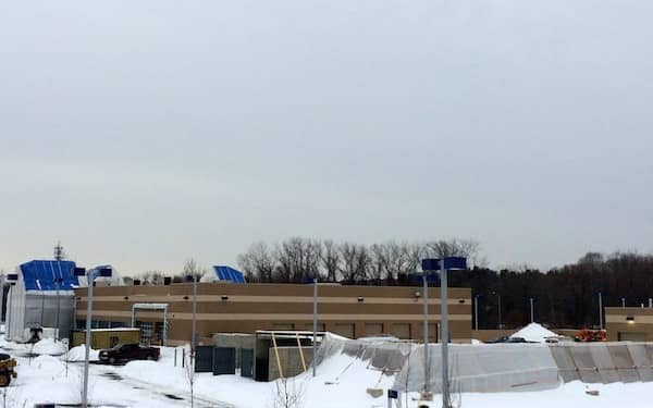 The new CarMax Superstore is taking shape, only partially obscured by recent snowfall.