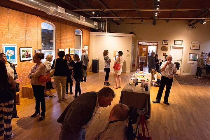 About 30 people turned out for the opening reception of the "Colors of Spring" exhibit at the Warwick Museum of Art May 13.