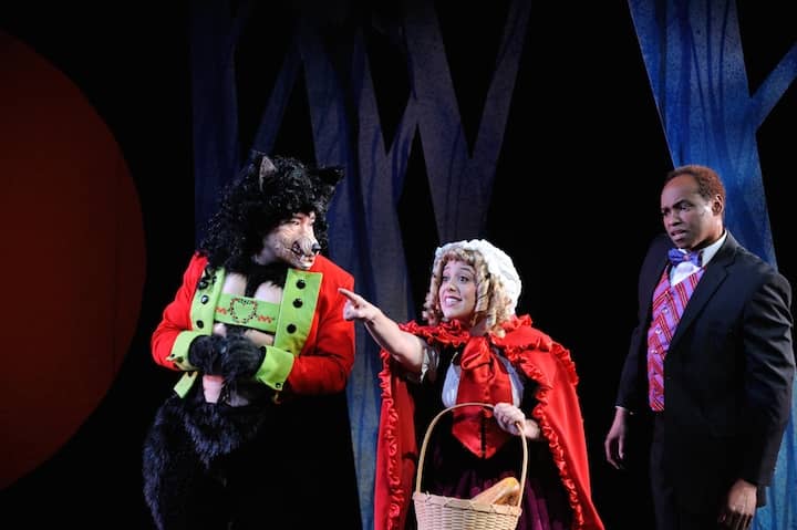 From left, Wayne Hu, Nicole Calkins, and Damron Russel Armstrong star as the Wolf, Little Red Ridinghood and the Narrator in Into the Woods at Ocean State Theatre.