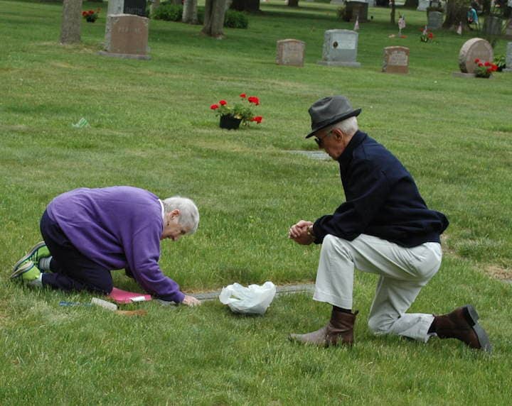 Charles and Ellen Fitzpatrick tend to their own cemetery plots Memorial Day at Pawtuxet Memorial Park . 