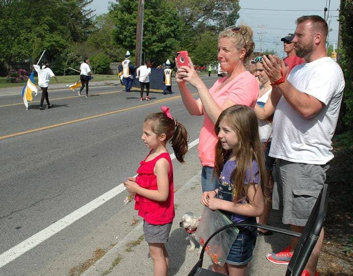Joshua and Susan Lavoie watch their daughter, Ryan march with the Warwick Vets High School Band with their daughters Joey and Kyle during the 2015 Memorial Day Parade.