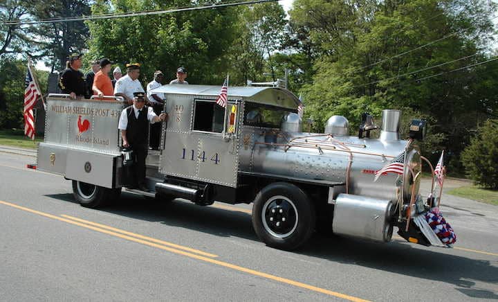 Members of American Legion Shields Post ride in the Memorial Day Parade March 25 on their recently restored vintage “40 & 8″ truck.