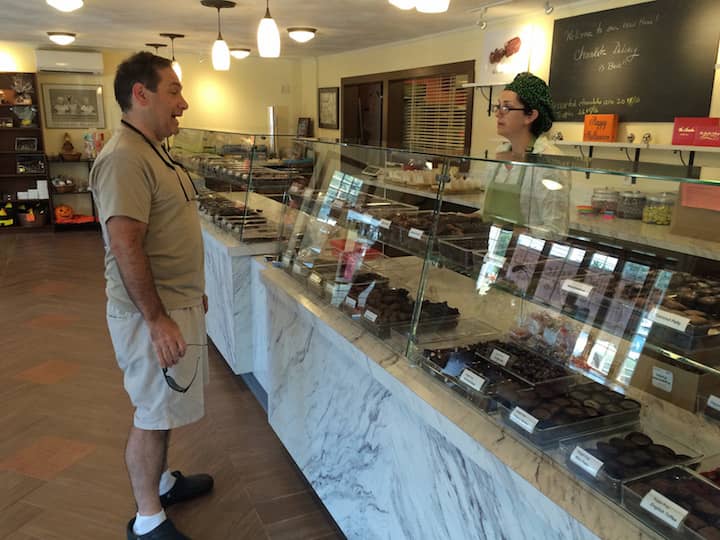 Jeff Herman picks out a few sweets during his visit to Chocolate Delicacy's new location in Apponaug.