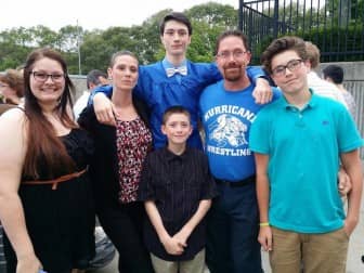 Misty Lourenco and her family, from left, daughter Destiny, Misty, son Davin, husband, Gil, son Jonny and, in front, her son, Jesse.