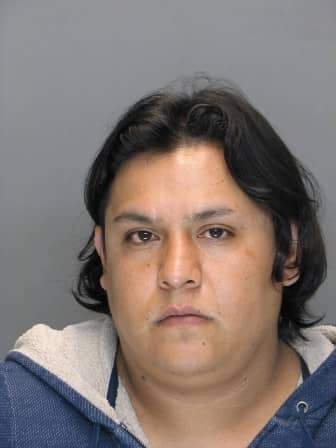 Moises Morales Canos is charged with skimming from ATMs in RI and CT.