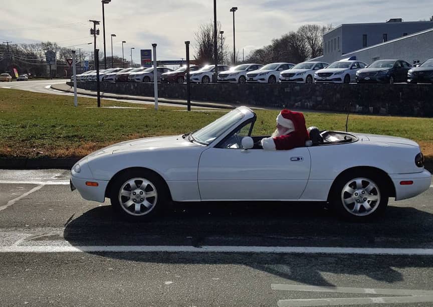 (CREDIT: Brian Allen) Santa took out his convertible for a spin at the intersection of Cowesett Avenue and Rte. 2 Friday.