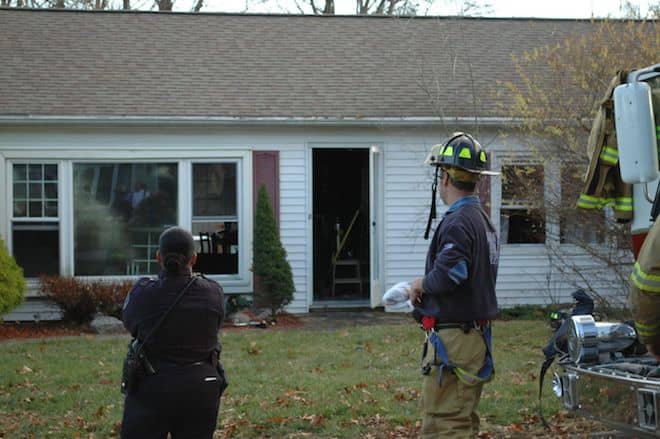 [CREDIT: Rob Borkowski]Police and firefighters outside 220 Diamond Hill Road shortly after Warwick Firefighters put out a living room fire in the home. 
