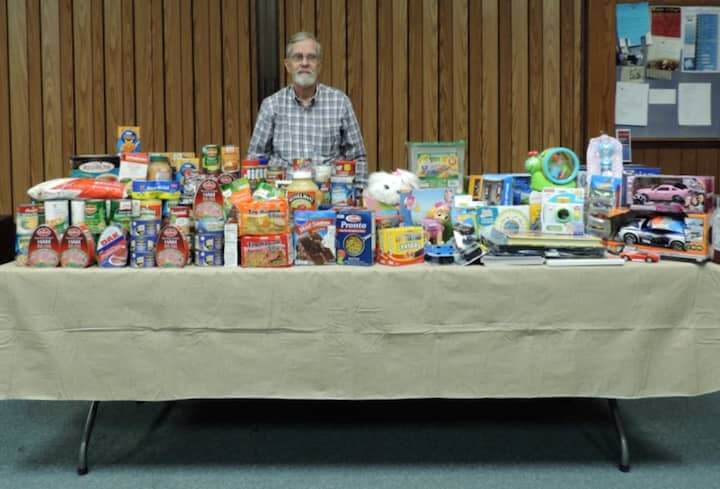 Lincoln Smith at Lakewood Baptist Church, where members of the Photographic Society of RI have collected food and toys for their annual drive benefitting Family Shelter of Warwick, RI.