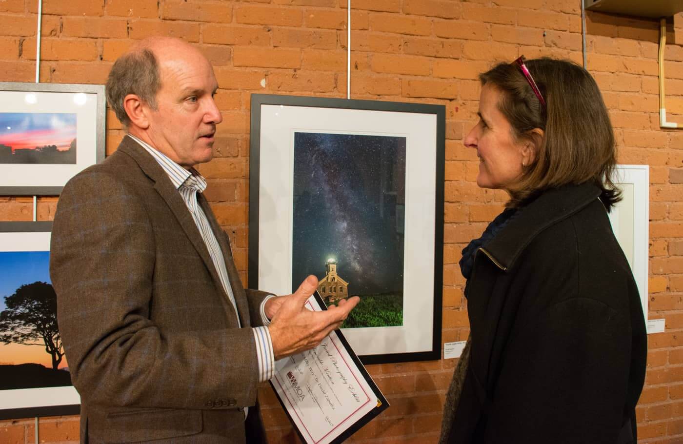 David Zapatka explains the process he used for his photograph, "North Light Milky Way" which won an honorable mention Wednesday night at WMOA.