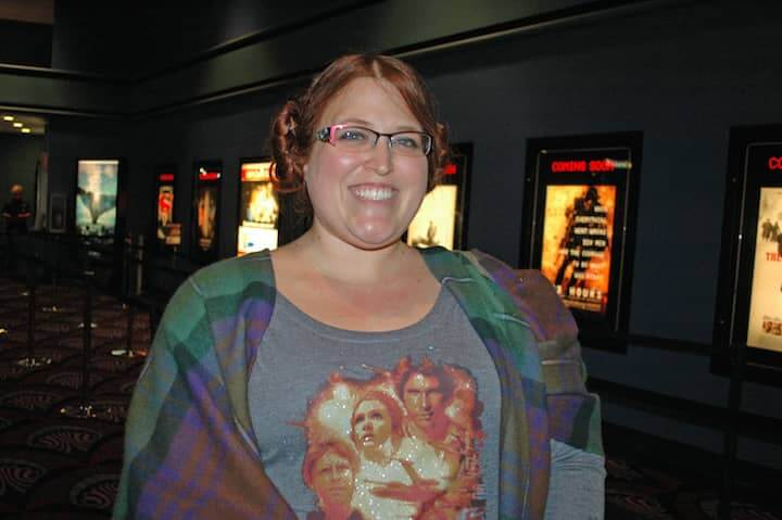 [CREDIT: Rob Borkowski]Erin Newell of Pawtucket, sporting Princess Leia hair buns and a Star Wars T-shirt, eagerly made her way to one of the first showings of The Force Awakens Dec. 17 at Showcase Cinemas.