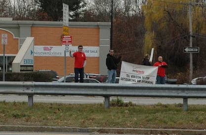 [CREDIT: Rob Borkowski] Protesters for IBEW -represented Verizon workers picketed outside the company's 400 Bald Hill Road retail location Sunday.