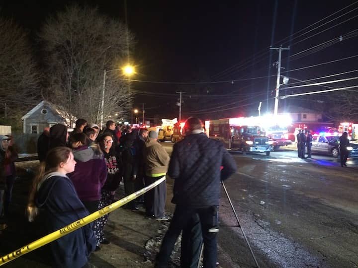 [CREDIT: Rob Borkowski] A crowd of about 40 people watches as firefighters worked to aid a driver and passenger aboard a RIPTA bus that crashed into RI Paintball at 1290 Post Road Monday night at 7:10 p.m.