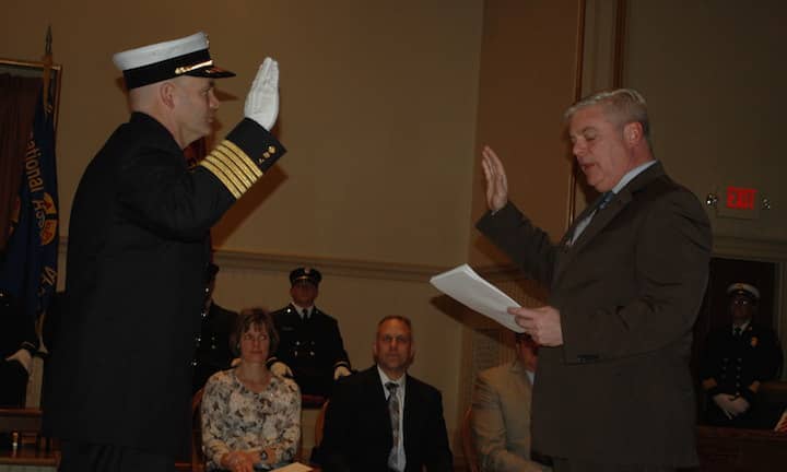 [CREDIT: Rob Borkowski] [CREDIT: Rob Borkowski} Chief James McLaughlin is sworn in by Mayor Avedisian.