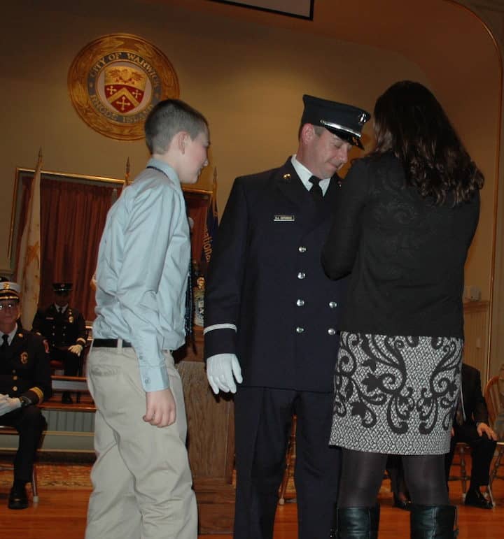 [CREDIT: Rob Borkowski] Dan DeRobbio is pinned as WFD Lt. by his wife, Cindy, son Danny, daughter, Brianna (not pictured).