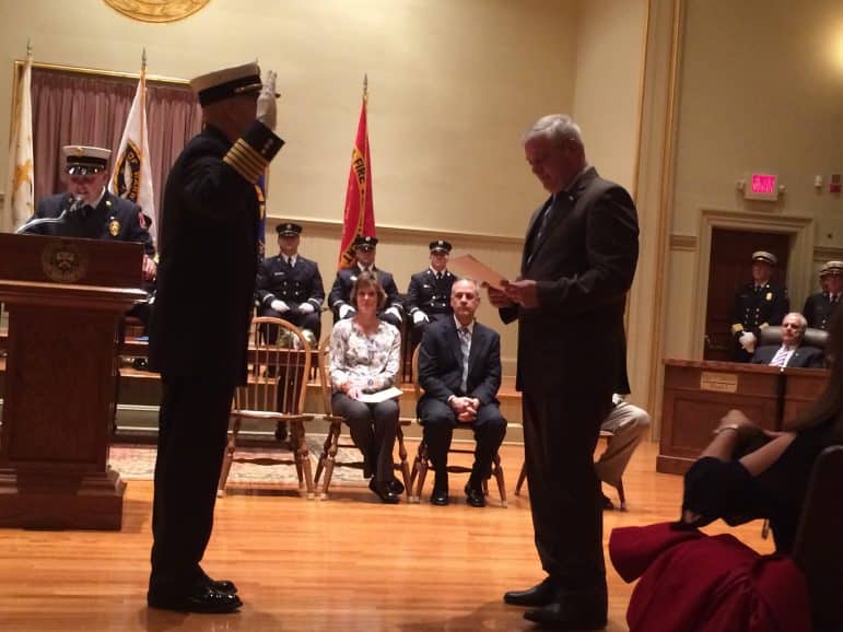 [CREDIT: Rob Borkowski] Chief McLaughlin is sworn in by Mayor Scott Avedisian.