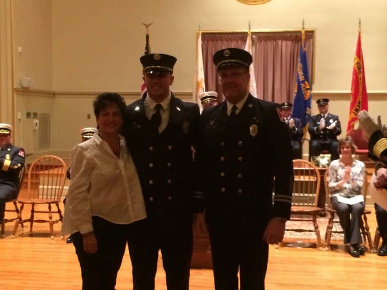 [CREDIT: Rob Borkowski] Bradford Ginaitt newly sworn in Rescue Lt., with his parents, retired Rescue Captain Richard and Mother, Sharon.