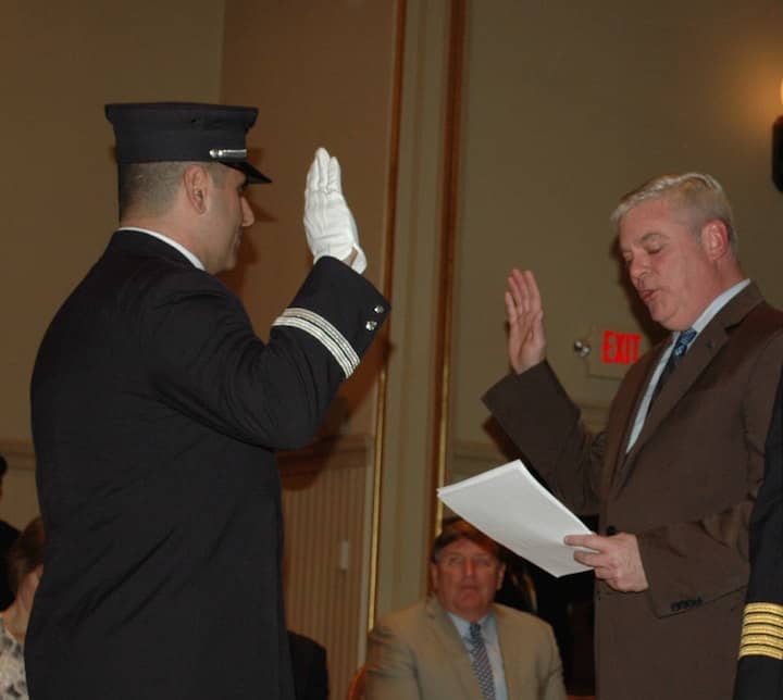 [CREDIT: Rob Borkowski] Gerard Bogossian, sworn in as Rescue Captain by Mayor Scott Avedisian.
