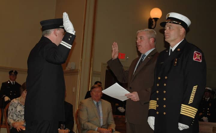 [CREDIT: Rob Borkowski] Firefighter Keith Brown is sworn in as Captain by Mayor Scott Avedisian.