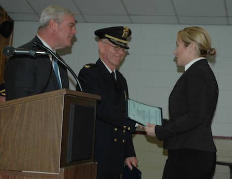 [CREDIT: Rob Borkowski} From left, Mayor Scott Avedisian and Col. Stephen McCartney present Nadine J. Parmenter with her certificate honoring her new rank as detective.
