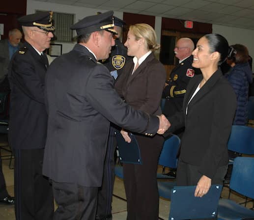 [CREDIT: Rob Borkowski} From left, WPD Chief Col. Stephen McCartney and Dep. Chief Michael Babula congratulate Nadine J. Parmenter, and Gilda T. Fortier on their new detective rank.