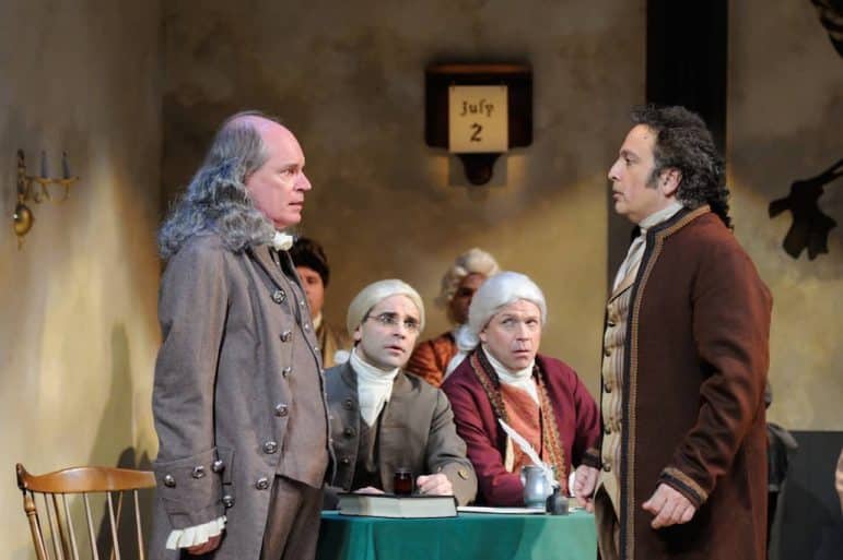 [CREDIT: Mark Turek] (foreground from left) Mark S. Cartier as Ben Franklin, Tommy Labanaris as James Wilson, Christopher Swan as John Dickinson and Lou Ursone as John Adams star in the Tony® Award-winning musical, about the birth of American Independence, 1776, being presented at Ocean State Theatre in Warwick through March 13. 