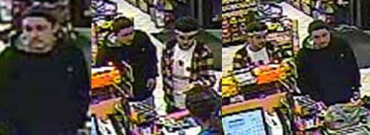 [CREDIT:WPD] Police are asking the public's help locating two men seen on camera using a stolen credit card Feb.1 in Warwick.