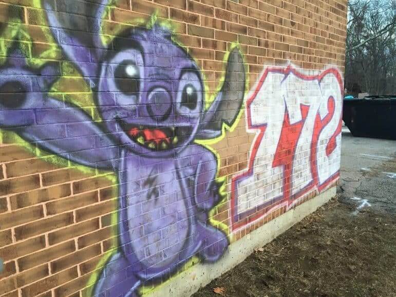 [CREDIT: WPD] A grafitti image of Stitch in Conimicut shared on the WPD facebook page Feb. 1. The Conimicut Neighborhood Association has listed a $500 reward for info leading to the arrest of the artist responsible for a number of graffiti works appearing throughout the village in February.