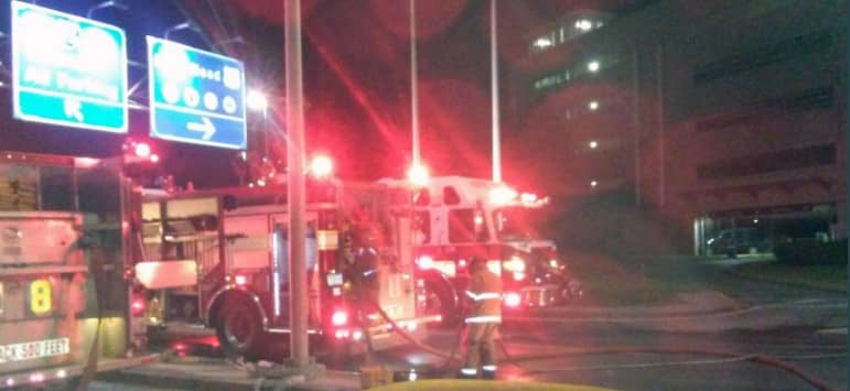 [CREDIT: The Providence Canteen] Warwick Fire trucks at the entrance to TF Green Airport as firefighters worked to put out a fire in the airport's Garage C.