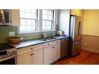 [CREDIT: Statewide MLS] The kitchen of 40 Valentine Ct. All new kitchen has soapstone counter, reclaimed hardwood floor, stainless appliances, recessed lighting