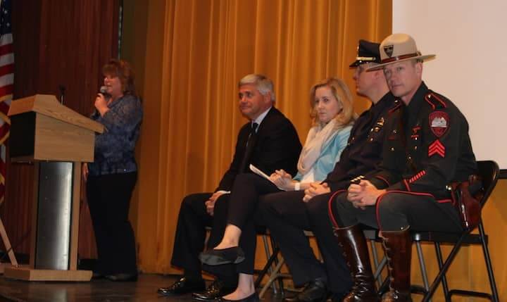 [CREDIT: Emily Martineau] Attorney General Kilmartin speaks to Pilgrim High juniors and seniors while Warwick Police Lt. Michael Gilbert, AT&T Regional Vice President of External Affairs Brooke Thomson, and RI State Police Sgt. Gregory Cunningham look on.