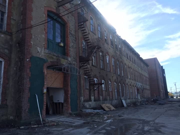 [CREDIT: Courtney Marciano] Mayor Scott Avedisian, developer Larry Silverstein, and Project Manager Michael Harrington toured Pontiac Mill Wednesday, March 2.