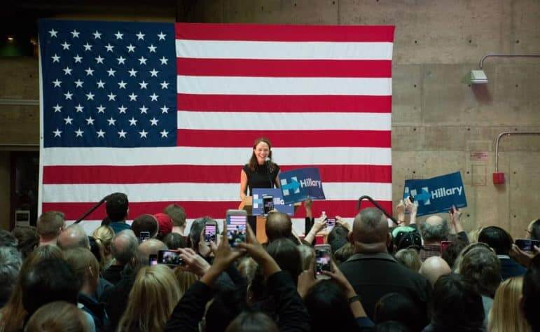 [CREDIT: Mary Carlos] CCRI President Meghan Hughes helps introduce former President Bill Clinton Thursday at the college's Knight Campus in Warwick. 