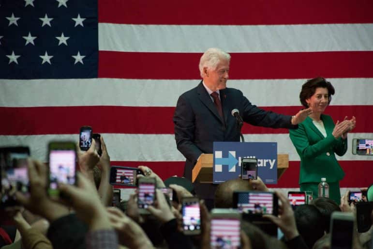  [CREDIT: Mary Carlos] Former president Bill Clinton and Gov. Gina Raimondo greet the crowd Thursday at the college's Knight Campus in Warwick. 