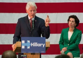 [CREDIT: Mary Carlos] Former president Bill Clinton addresses an excited crowd at CCRI's Knight Campus Thursday. Gov. Gina Raimondo, right, introduced him to generous applause.