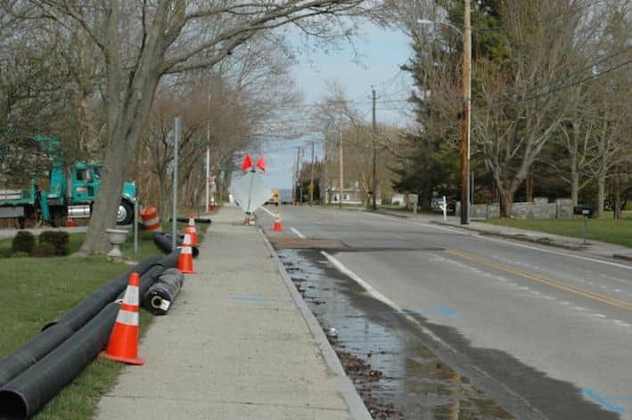 [CREDIT: Rob Borkowski] Ives Road closes Tuesday morning from Collins Avenue to Robert Avenue while City and RIDOT crews investigate the source of ground water causing minor road damage and pooling in nearby yards.