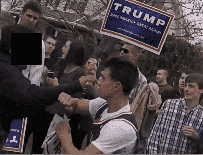 [CREDIT: Roderick Webber] A still shot from a video by Roderick Webber of two men scuffling at the Trump Rally in Warwick April 25. The man on the left's face has been blocked out by Roderick. Both men in the scuffle have been arrested by State Police.