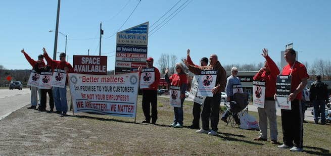 [CREDIT: Rob Borkowski] Verizon employees, members of IBEW, picket outside the company's retail location at Warwick Commons on Bald Hill Road Wednesday.