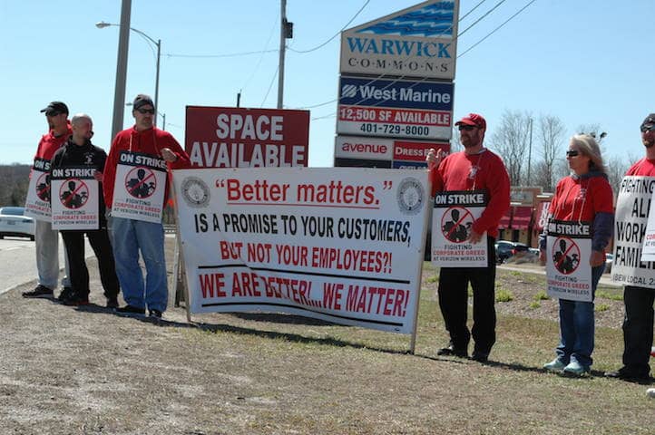 [CREDIT: Rob Borkowski] Verizon employees, members of IBEW, picket outside the company's retail location at Warwick Commons on Bald Hill Road Wednesday.