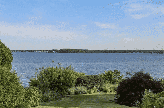 [CREDIT: Keller Williams Realty/Matt Patty] The adjacent lot at 346 Claypool Drive, with a view of Greenwich Bay.