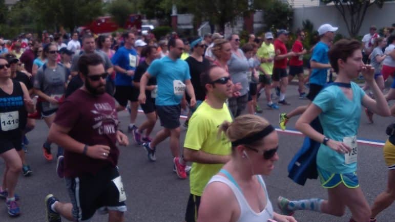 [CREDIT: Tina Suttles] Runners Jog down Narragansett Parkway in the 2016 GaspeeDays5K June 11. 