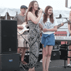 [CREDIT: Megan Harney] Megan Harney and Lexi Coons on stage together at the 2015 Coventry Relay for Life. A virtual Relay for Life will be held Aug. 22 at noon.