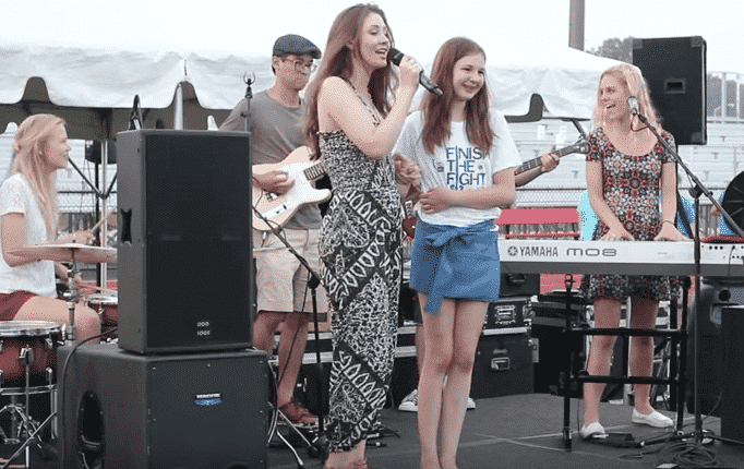 [CREDIT: Megan Harney] Megan Harney and Lexi Coons on stage together at the 2015 Coventry Relay for Life. A virtual Relay for Life will be held Aug. 22 at noon.