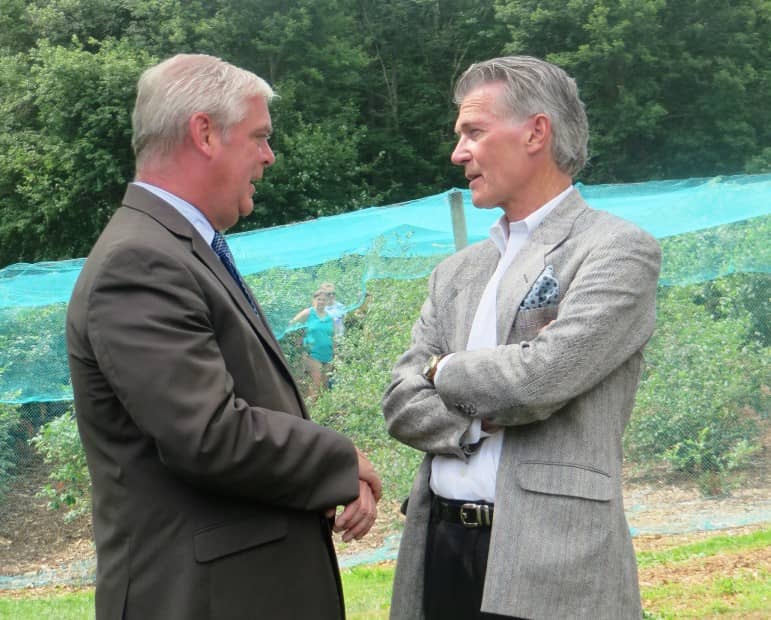 [CREDIT: Courtney Marciano] Mayor Scott Avediisan and Hugh Fisher speak Thursday on Rocky Point Avenue to celebrate the donation of 119 lots to the city.