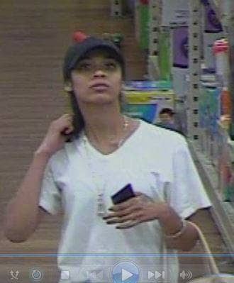 [CREDIT: WPD] Warwick Police are seeking information on this woman, recorded as she stole several items from WalMart's health and beauty aisle. 